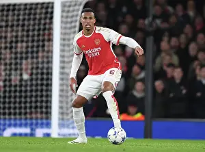 Arsenal V Sevilla 2023-24 Prints: Arsenal's Gabriel Faces Off: Arsenal FC vs Sevilla FC in the UEFA Champions League Battle