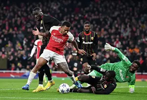 Arsenal V RC Lens 2023-24 Prints: Arsenal's Gabriel Jesus Faces Off Against RC Lens Massadio Haidara in Champions League Group Stage Clash