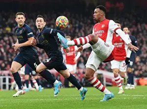 Arsenal's Gabriel Magalhaes Faces Off Against Burnley's Connor Roberts in Intense Premier League Clash