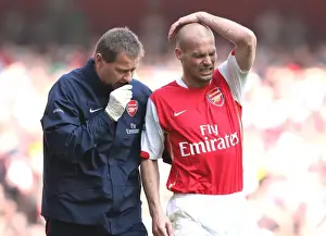 Arsenal's Gary Lewin Tends to Freddie Ljungberg: 2:1 Win Against Bolton Wanderers, 2007