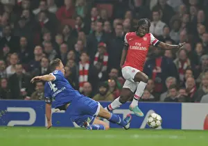 Arsenal V Schalke 04 2012-13 Prints: Arsenal's Gervinho Clashes with Schalke's Benedikt Howedes in 2012-13 Champions League Showdown