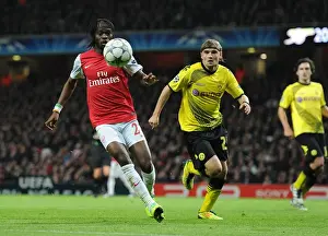 Arsenal V Borussia Dortmund 2011-12 Prints: Arsenal's Gervinho Outmaneuvers Dortmund's Schmelzer in Champs League Showdown (2011-12)