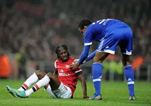 Arsenal V Schalke 04 2012-13 Prints: Arsenal's Gervinho and Schalke's Matip Share a Moment during Champions League Clash