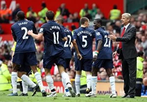 Manchester United v Arsenal 2009-10 Collection: Arsenal's Glory: Arshavin's Double and the Triumph over Manchester United in the Premier League