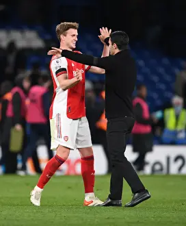 Arsenal's Glory: Mikel Arteta and Rob Holding Celebrate Hard-Fought Premier League Victory over Chelsea