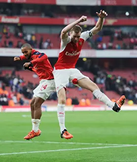 Arsenal's Glory: Theo Walcott and Per Mertesacker Celebrate Hard-Fought Victory Over Manchester United (2015/16 Premier League)