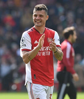 Images Dated 23rd April 2022: Arsenal's Granit Xhaka Celebrates with Fans After Arsenal vs Manchester United Win