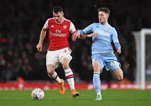 Arsenal V Leeds United FA Cup 2019-20 Prints: Arsenal's Granit Xhaka Clashes with Leeds Jordan Stevens in FA Cup Showdown