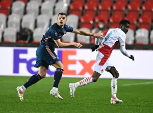 Arsenal's Granit Xhaka Clashes with Slavia Praha's Peter Olayinka in UEFA Europa League Quarterfinal: Prague Showdown