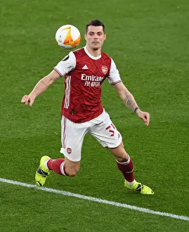 Arsenal's Granit Xhaka in Europa League Action Against Olympiacos Amid Empty Emirates Stadium