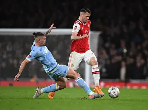Arsenal's Granit Xhaka Outmaneuvers Leeds Kalvin Phillips in FA Cup Clash