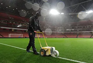 Arsenal V Chelsea 2013-14 Prints: Arsenal's Groundsman Braves the Rain to Prepare for Arsenal v Chelsea Showdown