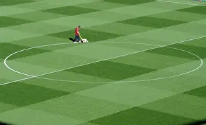 Arsenal's Groundsman Paul Ashcroft Prepares the Emirates Pitch for Arsenal's 2:1 UEFA Champions League Victory over Olympiacos (Group F)