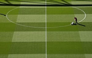 Images Dated 26th September 2018: Arsenal's Groundsman Prepares Pitch for Carabao Cup Clash Against Brentford
