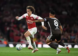 Arsenal V Brentford - Carabao Cup 2018-19 Prints: Arsenal's Guendouzi Clashes with Brentford's Yennaris in Carabao Cup Showdown