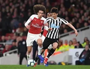 Arsenal V Newcastle United 2018-19 Prints: Arsenal's Guendouzi Clashes with Newcastle's Ki in Premier League Showdown