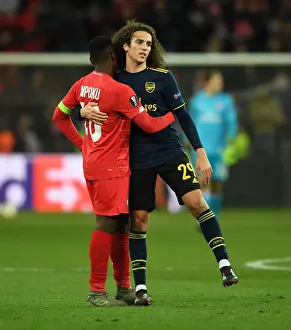 Arsenal's Guendouzi Embraces Mpoku After Standard Liege Clash in Europa League