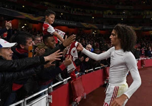 Images Dated 24th October 2019: Arsenal's Guendouzi Gifts Shirt to Fan after Europa League Victory over Vitoria Guimaraes