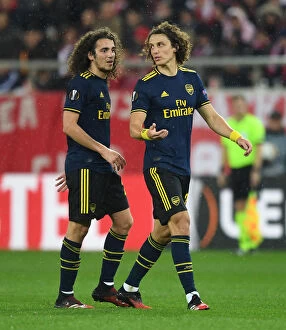 Olympiacos v Arsenal 2019-20 Collection: Arsenal's Guendouzi and Luiz Face Off Against Olympiacos in Europa League Clash