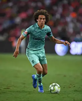 Arsenal's Guendouzi Takes on Paris Saint-Germain: A Clash of Rising Stars in International Champions Cup (2018, Singapore)