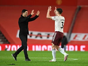Images Dated 1st November 2020: Arsenal's Historic Victory at Old Trafford: Mikel Arteta and Kieran Tierney Celebrate Amidst Empty