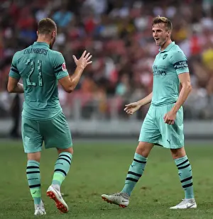 Arsenal's Holding and Chambers Celebrate Goal Against Paris Saint-Germain in 2018 International Champions Cup, Singapore