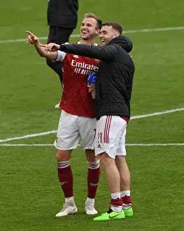 Arsenal's Holding and Chambers: Savoring Success Against Brighton in the 2020-21 Premier League