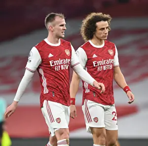 Arsenal's Holding and Luiz: Emirates Stadium Showdown Amidst Empty Seats (Arsenal v Crystal Palace, Premier League 2021)