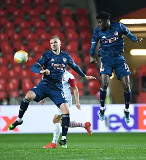 Arsenal's Holding and Partey in Quiet Eden Arena: Arsenal FC vs Slavia Praha, UEFA Europa League Quarterfinal (Behind Closed Doors)