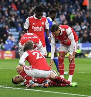 Images Dated 25th February 2023: Arsenal's Injured Martinelli and Team Mates Amid Leicester Battle
