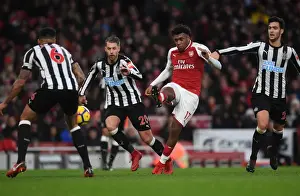 Arsenal V Newcastle United 2017-18 Prints: Arsenal's Iwobi Faces Off Against Newcastle's Merino and Lejeune