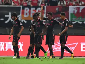 Arsenal's Iwobi, Nelson, and Bramall Celebrate Goal Against Bayern Munich in Shanghai Friendly, 2017