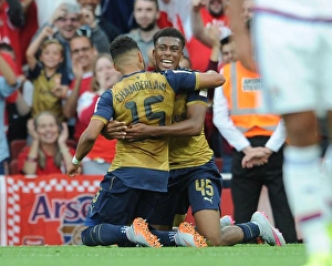 Arsenal V Olympique Lyonnais - Emirates Cup 2015/16 Prints: Arsenal's Iwobi and Oxlade-Chamberlain Celebrate Goal Against Olympique Lyonnais