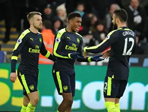 Swansea City V Arsenal - 2016-17 Prints: Arsenal's Iwobi, Ramsey, and Giroud Celebrate Goals Against Swansea City (January 2017)