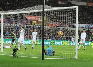 Swansea City V Arsenal - 2016-17 Prints: Arsenal's Iwobi Scores Deflected Goal Past Former Team-Mate Fabianski in Swansea Clash