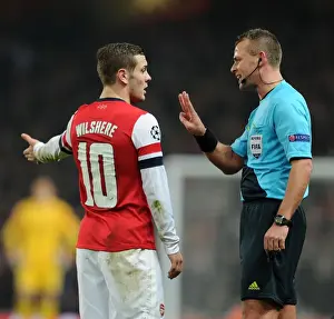 Arsenal V Bayern Munich 2012-13 Prints: Arsenal's Jack Wilshere Argues with Referee Svein Oddvar Moen during Arsenal v Bayern Munich UEFA Champions League