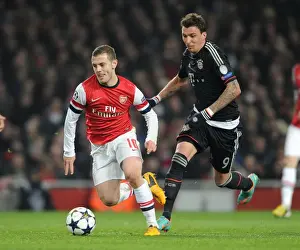 Arsenal's Jack Wilshere Clashes with Bayern's Mario Mandzukic in Champions League Showdown