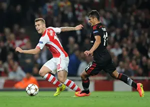 Arsenal's Jack Wilshere Clashes with Besiktas Mustafa Pektemek in UEFA Champions League Qualifier