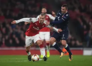 Arsenal V Red Star Belgrade 2017-18 Prints: Arsenal's Jack Wilshere Clashes with Crvena Zvezda's Nenad Krsticic in Europa League Showdown