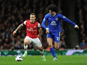 Images Dated 16th April 2013: Arsenal's Jack Wilshere Clashes with Everton's Marouane Fallaini in Premier League Showdown
