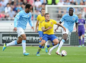 Arsenal V Manchester City Pre Season 2013-14 Prints: Arsenal's Jack Wilshere Clashes with Manchester City's Yaya Toure and Joleon Lescott during Pre-Season Friendly