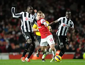 Arsenal's Jack Wilshere Clashes with Newcastle's Ba and Tiote in Premier League Showdown