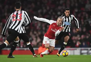 Arsenal V Newcastle United 2017-18 Prints: Arsenal's Jack Wilshere Clashes with Newcastle's Isaac Hayden in Premier League Showdown