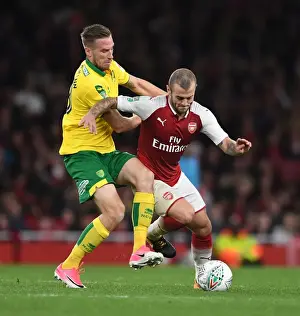 Arsenal V Norwich - Carabo Cup 4th Round 2017-18 Prints: Arsenal's Jack Wilshere Clashes with Norwich's Marco Stiepermann in Carabao Cup Showdown