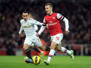 Arsenal V Swansea 2012-13 Prints: Arsenal's Jack Wilshere Clashes with Swansea's Leon Britton during the 2012-13 Premier League Match