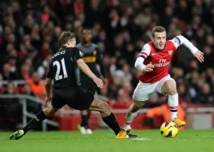 Arsenal's Jack Wilshere Evades Liverpool's Lucas Leiva During Intense Premier League Clash