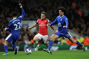 Arsenal's Jack Wilshere Faces Off Against Everton's Steven Pienaar and Marouane Fellaini