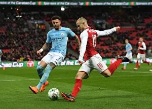 Images Dated 25th February 2018: Arsenal's Jack Wilshere Faces Off Against Manchester City's Kyle Walker in Carabao Cup Final