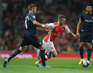 Arsenal's Jack Wilshere Faces Off Against Southampton's Morgan Schneiderlen in League Cup Clash