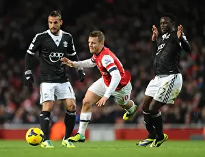 Arsenal V Southampton 2013-14 Prints: Arsenal's Jack Wilshere Faces Off Against Southampton's Victor Wanyama and Dani Osvaldo in Premier League Clash
